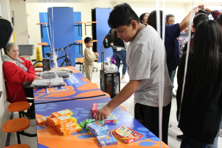 A Cowherd student picks his raffle prize.